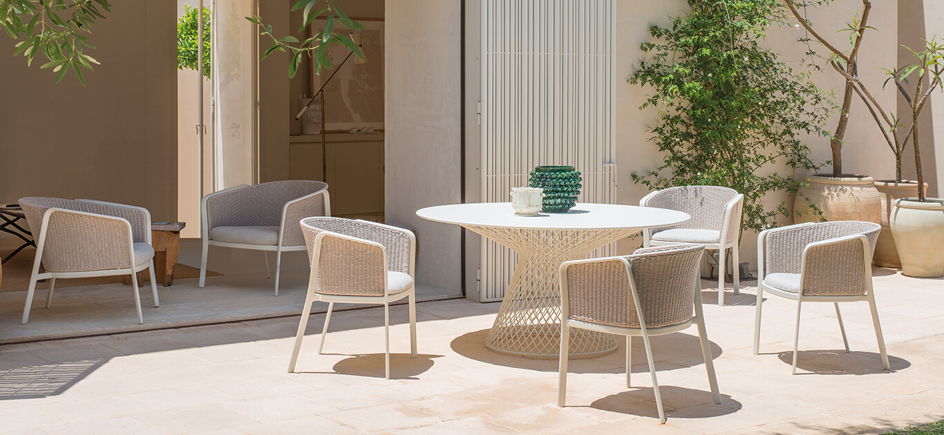 Carousel collection is made up of: four versions of dining armchair, three versions of lounge armchair, sofas, poufs, square and rectangular coffee tables. The easel frame is made of aluminum tubular. The seat, made by a sheet of aluminium alloy which is drawn to have an even shape, and then is following fixed to the aluminium frame through a structural welding, performed with TIG technology that gives particular resistance as well as a better standard in terms of aesthetics. The structure of the steel backrest supports the decorative patterns proposed in the various materials. All selected materials guarantee long-lasting resistance and color stability. Because the above mentioned materials, the product is strongly suitable for all uses in marine environments and in extreme weather conditions.The poufs have an oval aluminum tubular structure while the tables have a steel rod structure with an aluminum alloy top, adjustable insoles in nylon and stainless steel screw. They are all decorated with rope weaving.